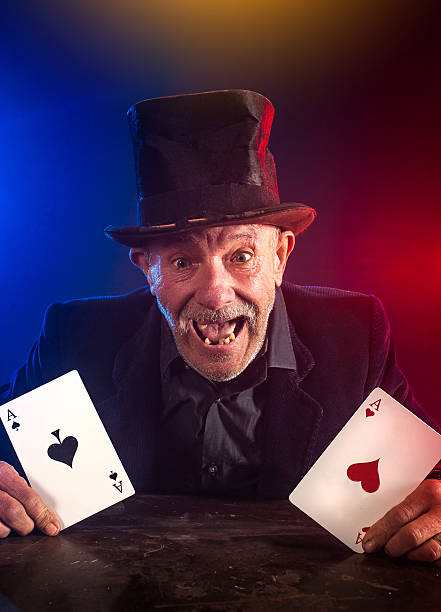 istock Senior man making trick with playing cards 532169513