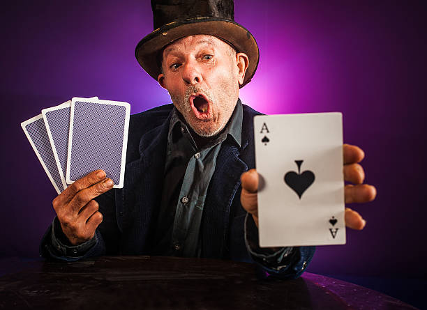 istock Senior man making trick with playing cards 532169547