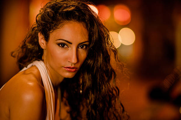 Beautiful caucasian girl in warm city lights