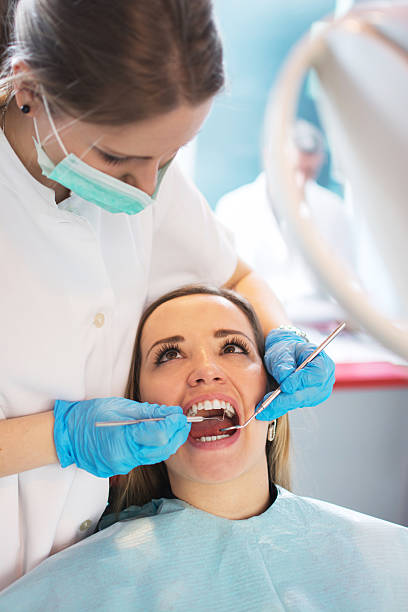 istock Dentist examining a patient's teeth in the dental office. 532170670