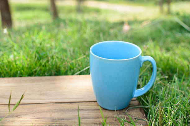 istock green space mug grass and wooden board. 532170811