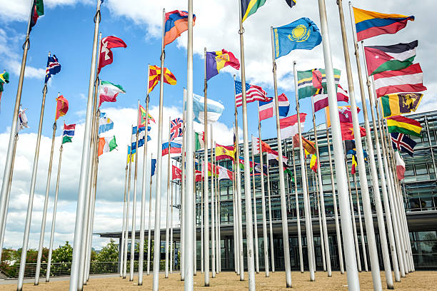 istock International flags in front of an business building 532170849