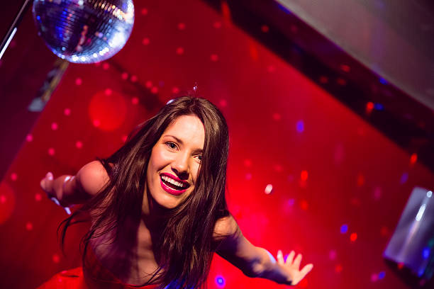istock Pretty brunette dancing and smiling 532171515