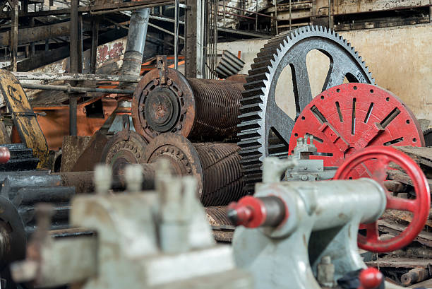 istock Huge cog wheel in industrial hall 532172138