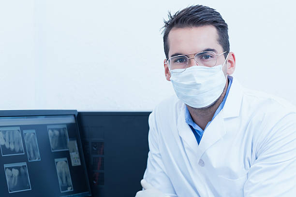istock Dentist wearing surgical mask 532172353