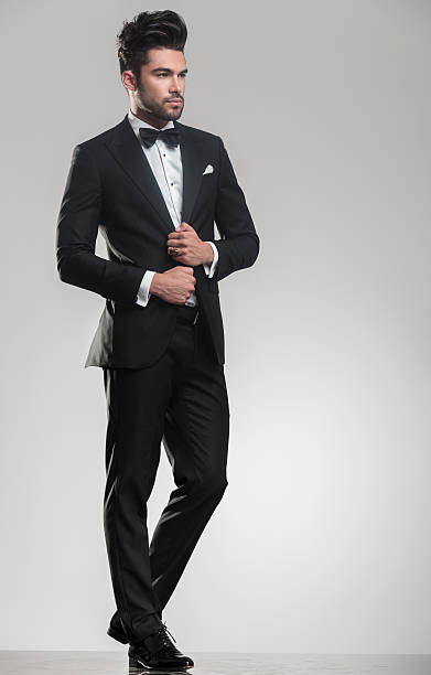 istock elegant man in tuxedo looking away from the camera 532172397