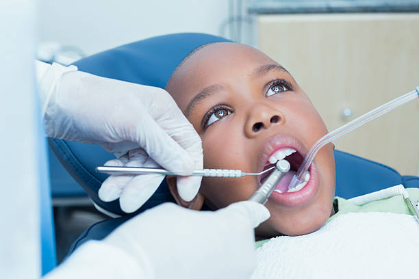 istock Boy having his teeth examined by dentist 532172521
