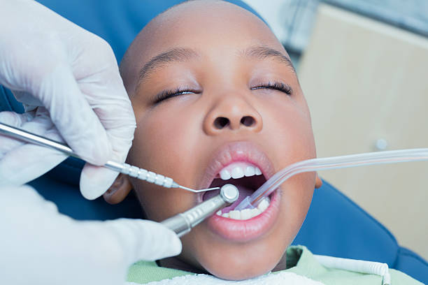 istock Boy having his teeth examined by dentist 532172523
