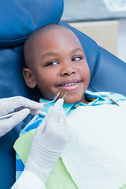 istock Close up of boy having his teeth examined 532172879