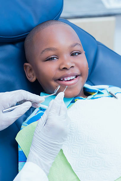 istock Boy having his teeth examined by dentist 532172901