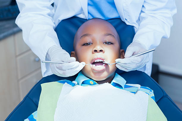 istock Close up of boy having his teeth examined 532174161