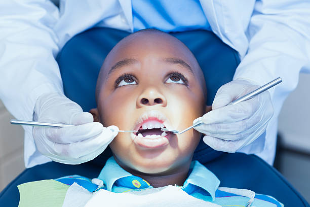istock Close up of boy having his teeth examined 532174317