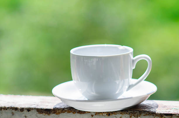 istock White coffee cup with nature light outdoor. 532174343
