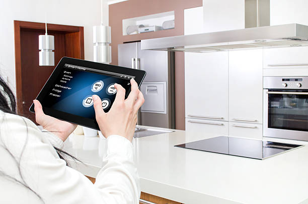 Conception of smart kitchen controlled by tablet application. Tablet's interface has been created in a graphics program electromagnetic induction stock pictures, royalty-free photos & images