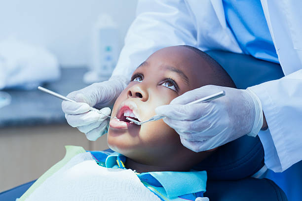istock Close up of boy having his teeth examined 532174491