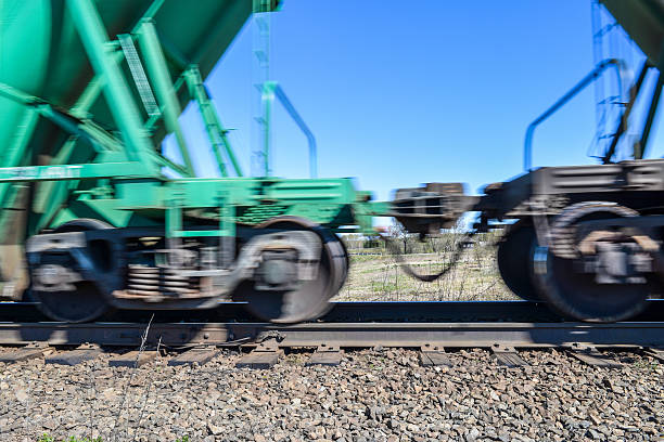 istock wagons of a freight train moving fast along the rails 532175786