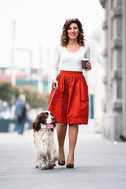 istock Woman walking her dog 532176146
