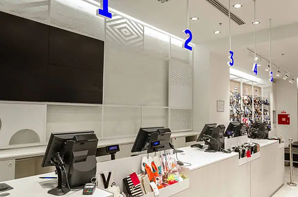 Photo of Counter with cash registers and monitors