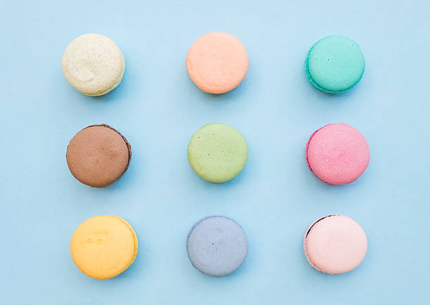 istock Sweet colorful French macaroon biscuits on pastel blue background 532177340