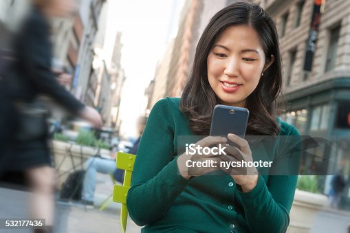 istock Young asian woman texting on smartphone 532177436