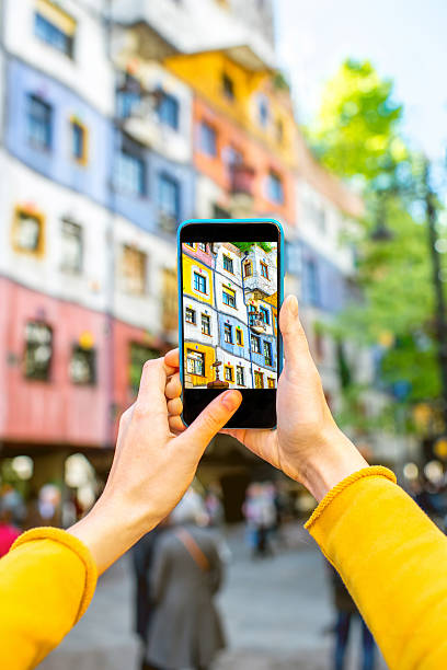 Photographing colorful building facade Photographing with smart phone colorful building facade in Vienna hundertwasser haus in vienna austria stock pictures, royalty-free photos & images