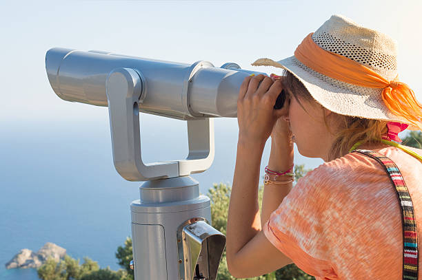 istock Woman looking thru binoculars at the horizon. 532179694