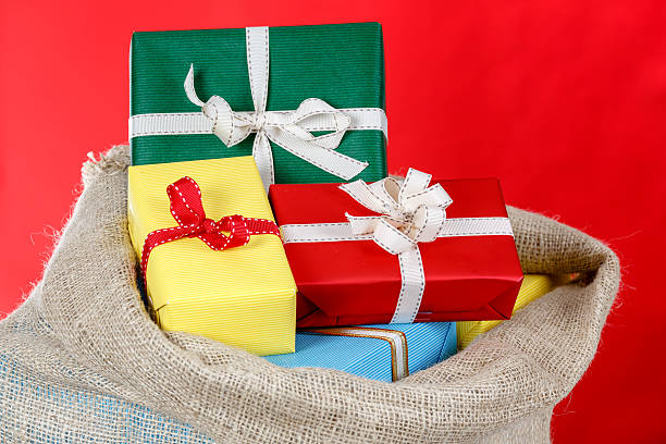 istock Presents in a bag on a red background 532180310