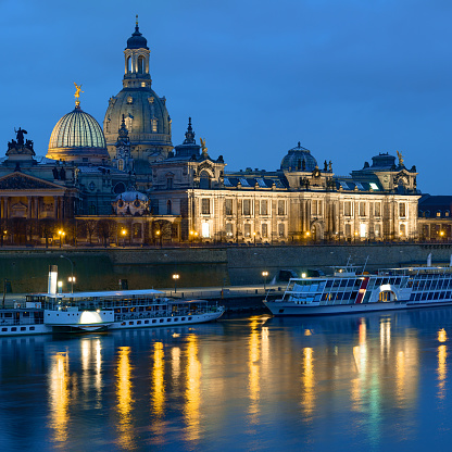 Dresden at night, with historical passenger ships, Bruhl's Terrace and Frauenkirchem reflected in the river