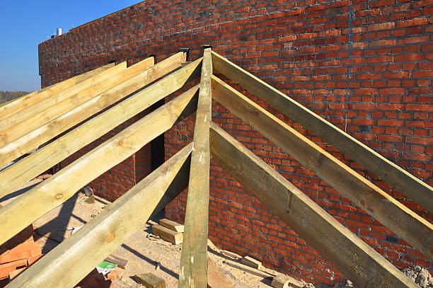 istock Wooden rafters, eaves, wooden beams installed on brick wall 532181154
