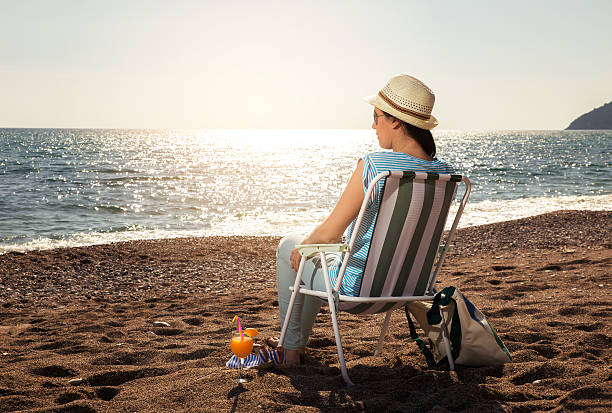 istock Woman relaxing at the beach 532182478