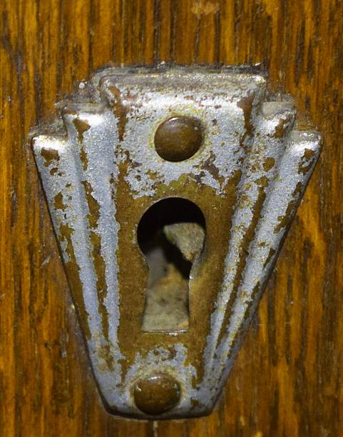 istock vintage art deco metal key hole close up 532184792