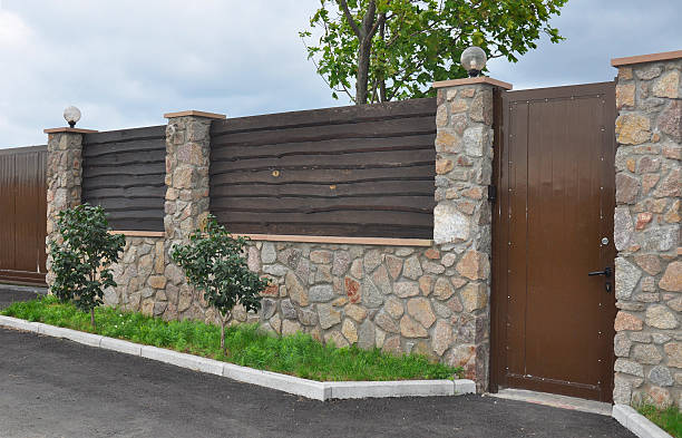 istock Stone and Metal Fence 532184956
