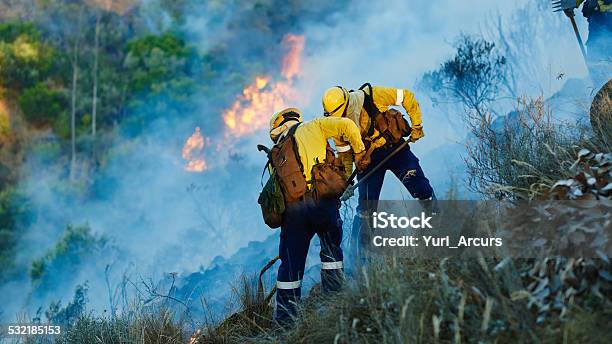 Pushing Back The Flames Stock Photo - Download Image Now - 2015, Adult, Copy Space