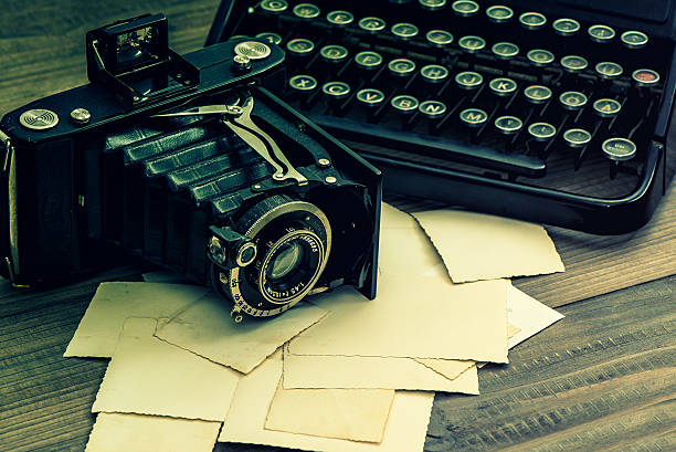 istock Vintage photo camera and typewriter. Retro toned 532185556