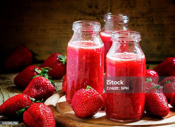 Strawberry Smoothie In Glass Bottles Fresh Berries Stock Photo - Download Image Now