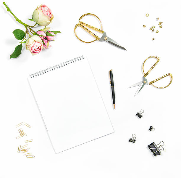 Flat lay with sketchbook, flowers, office tools Flat lay with sketchbook, flowers, office tools on white background gold scissors stock pictures, royalty-free photos & images