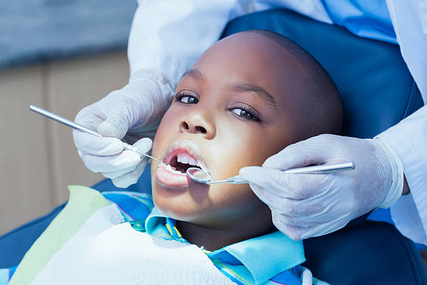 istock Close up of boy having his teeth examined 532186637