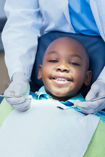 istock Close up of boy having his teeth examined 532186911