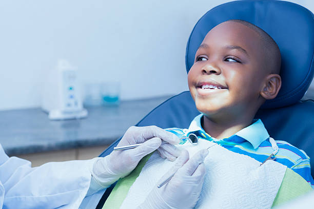 istock Close up of boy having his teeth examined 532187269