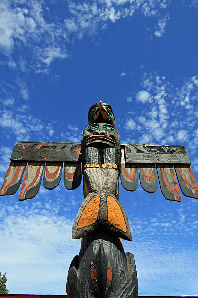 Totem Pole Duncan, Canada - June 22th, 2011: One of the Totem Poles in Duncan, standing on and around the market place. Vancouver Island. British Columbia. Canada duncan british columbia stock pictures, royalty-free photos & images