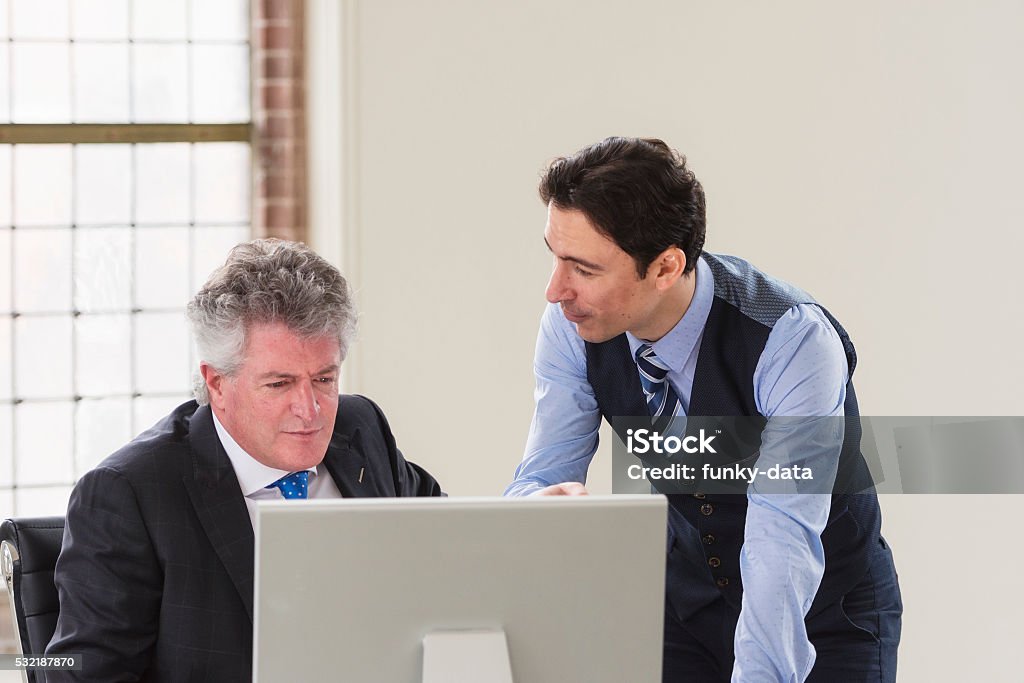 Managers Explaining Young Talent Explaining To His Manager Stock Photo - Download Image Now ...