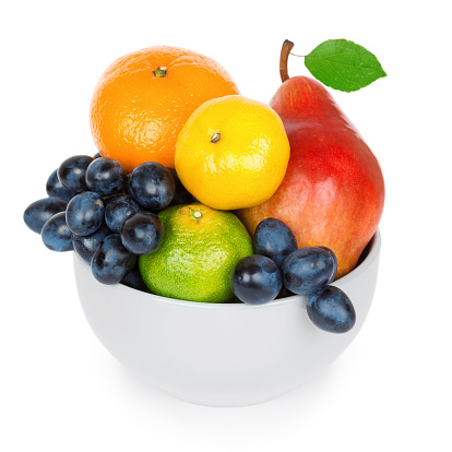 Bowl with fruits on white background
