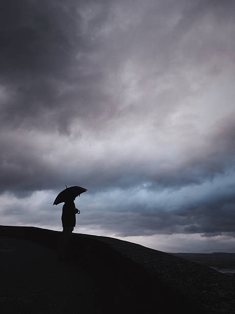 istock Man against stormy sky. 532188987