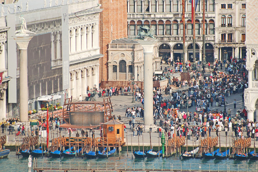 A large gathering in St. Mark's square of tourists taken from above.