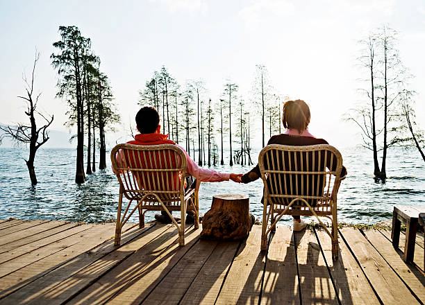 istock Couple enjoying the lake sunset 532189510