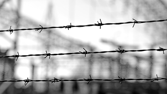 three lines of barbed wire to demarcate the border