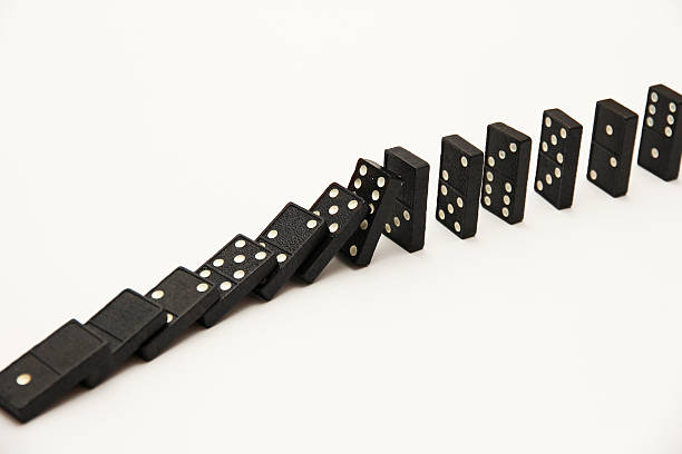 istock Falling line of dominoes 532191449