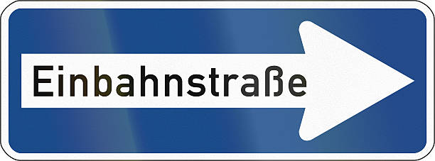 One-Way To The Right German traffic sign: Einbahnstrasse/One-way road, pointing to the right. one way stock pictures, royalty-free photos & images