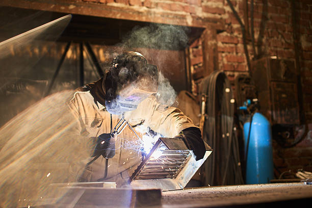 istock The welder produces welding parts 532191952