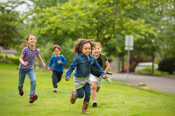 istock Friendly neighborhood children playing together outside 532192558